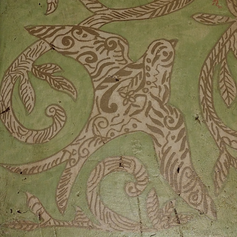 Kate McRostie hand-painted tile wall hanging with bird in sage green